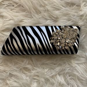 Velvet zebra striped clutch with brooch